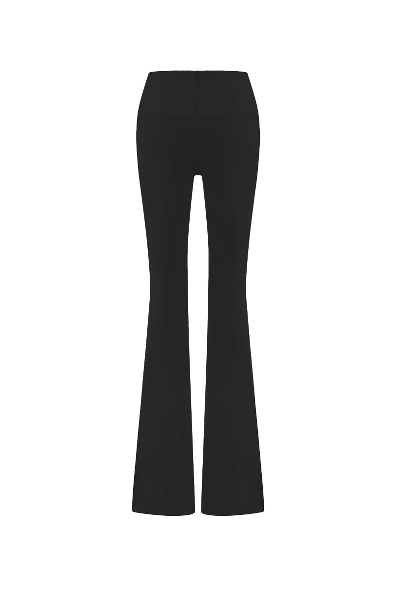 Black wide-leg draped pants by Zeynep Tosun, shown from the back with flowing fabric and relaxed fit.