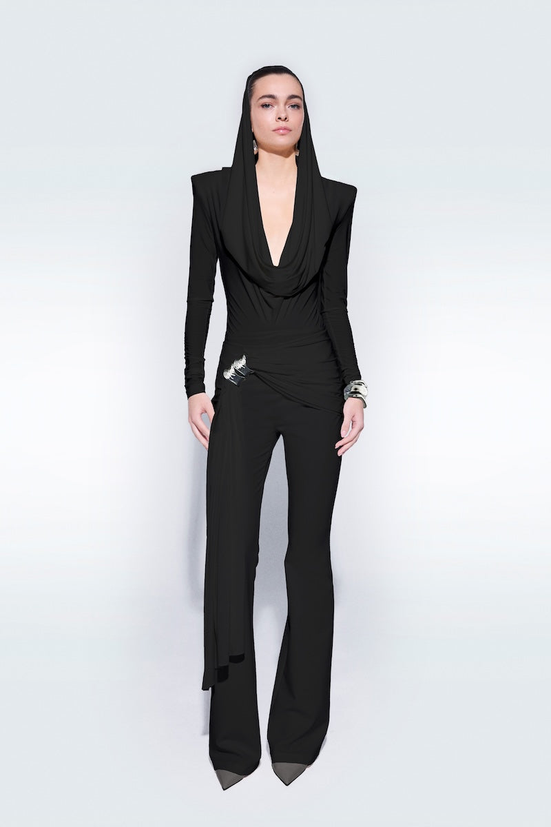 Black draped top by Zeynep Tosun, stylish and elegant, shown on a model with flowing fabric and modern design.