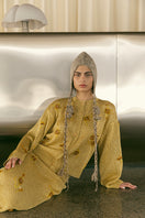 Gold knitted maxi skirt with embroidered details from Lalo, showcasing a flowing design and intricate embroidery.