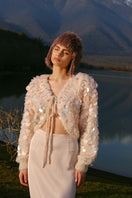 Lalo pink cropped cardigan with intricate embroidery details, long sleeves, and a soft knit fabric.