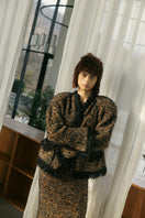 Soft knitted Lalo cardigan with a round neckline, featuring a cozy, stylish design perfect for casual wear.
