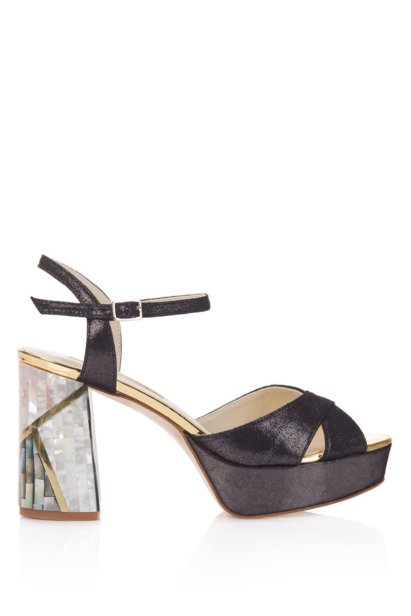 Elegant black heels by Freya Rose featuring a sleek design and pointed toe, perfect for formal occasions.