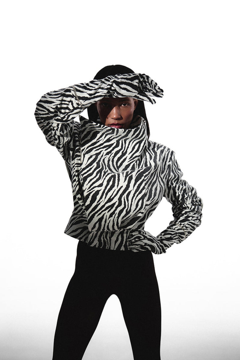 Kris Marán high neck zebra print bomber jacket with matching gloves, stylish and warm outerwear for cold weather.