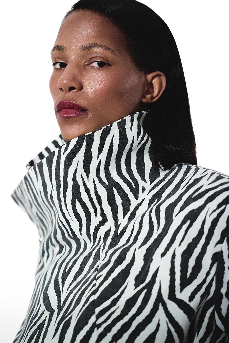 Kris Marán high neck zebra bomber jacket with matching gloves, stylish black and white animal print outerwear for women.