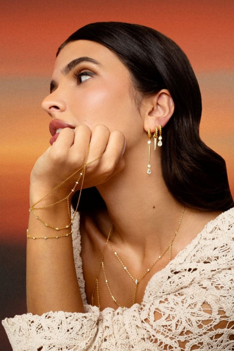 Gold Zeen hand chain bracelet by Velvet Desert featuring intricate chain links and a delicate design.