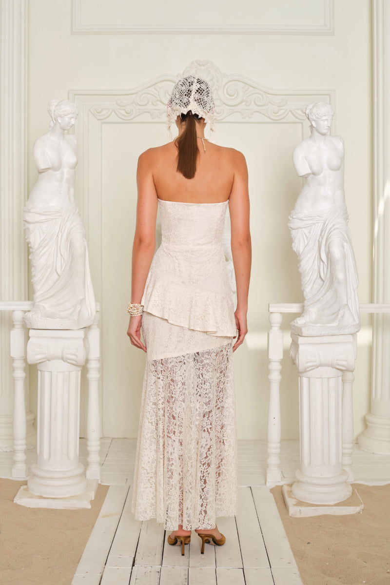 Nana Gotti Zephyra midi dress in flowing fabric with a fitted waist and elegant design, perfect for stylish occasions.