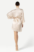 NK IMODE zero waste robe in champagne color, soft and sustainable fabric, displayed hanging with a smooth fabric texture.
