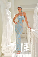 Nana Gotti Zeyna Maxi Dress in flowing fabric with a fitted waist and elegant silhouette, perfect for summer or special occasions.