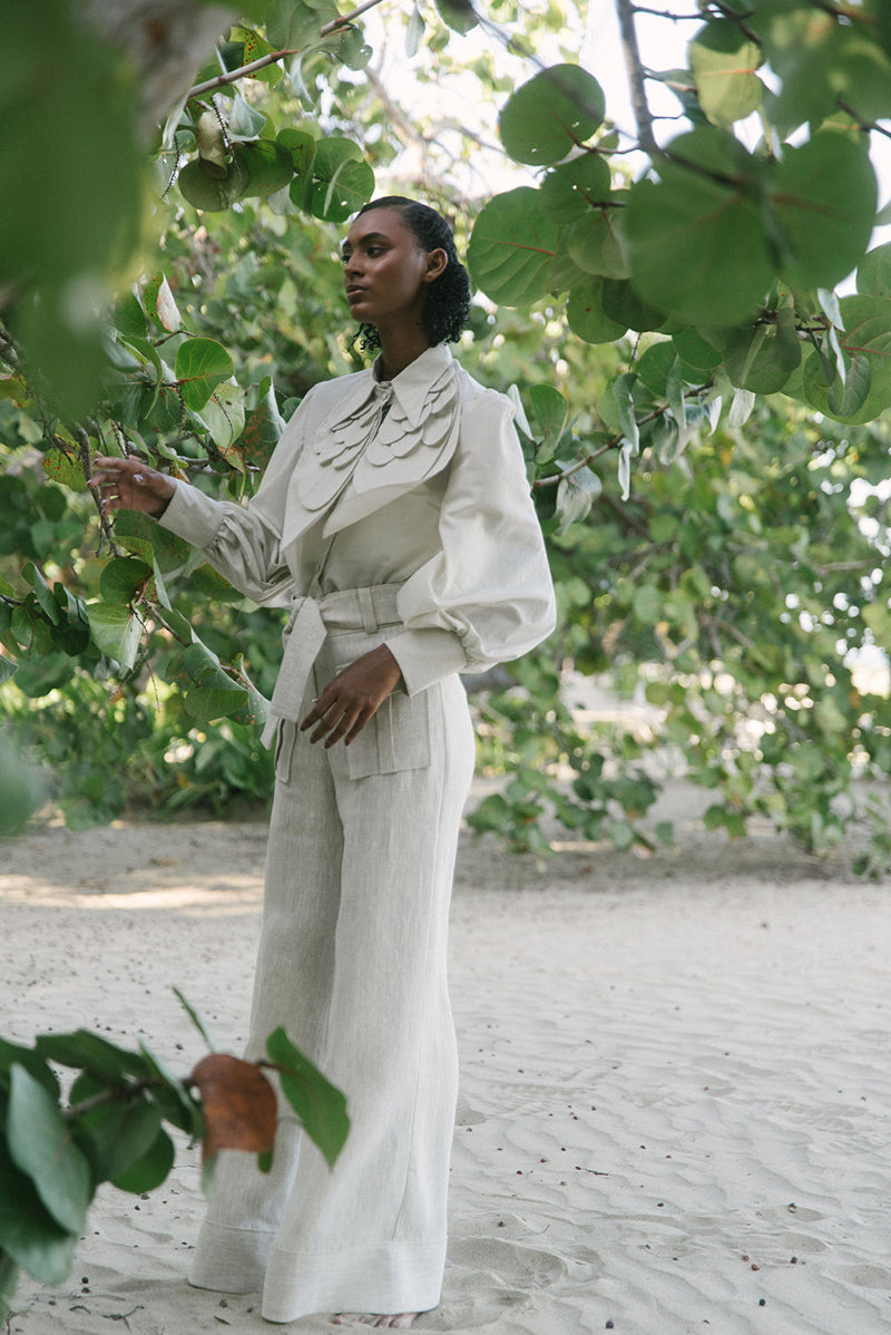 Light beige ZIMA pants by ANA + MARIA, shown in a natural pose with a casual fit and soft fabric in a campaign photo.