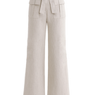 Light beige Zima pants by ANA + MARIA displayed on a ghostly figure, showcasing relaxed fit and soft fabric in natural setting.