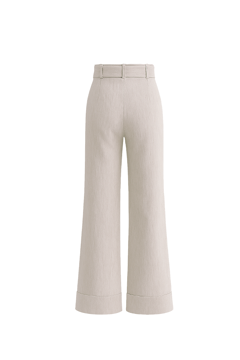 Light-colored ZIMA pants in sand from ANA + MARIA displayed on a ghostly background, showcasing relaxed fit and stylish design.