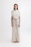 ANA + MARIA ZIMA pants in sand color, high-waisted pants with a relaxed fit, shown in a high-resolution image.