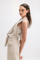 Light beige ZIMA pants in sand color by ANA + MARIA, showing a relaxed fit with a smooth fabric finish.