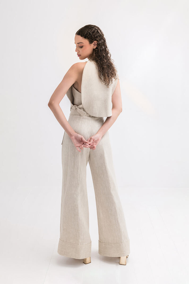 Light beige ZIMA pants in sand color by ANA + MARIA, displayed on a model showcasing a relaxed fit and casual style.