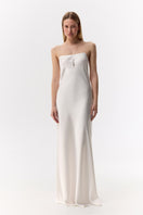 Serenity ZOE white silk satin maxi gown displayed on a hanger, showcasing its elegant flowing design and smooth fabric.