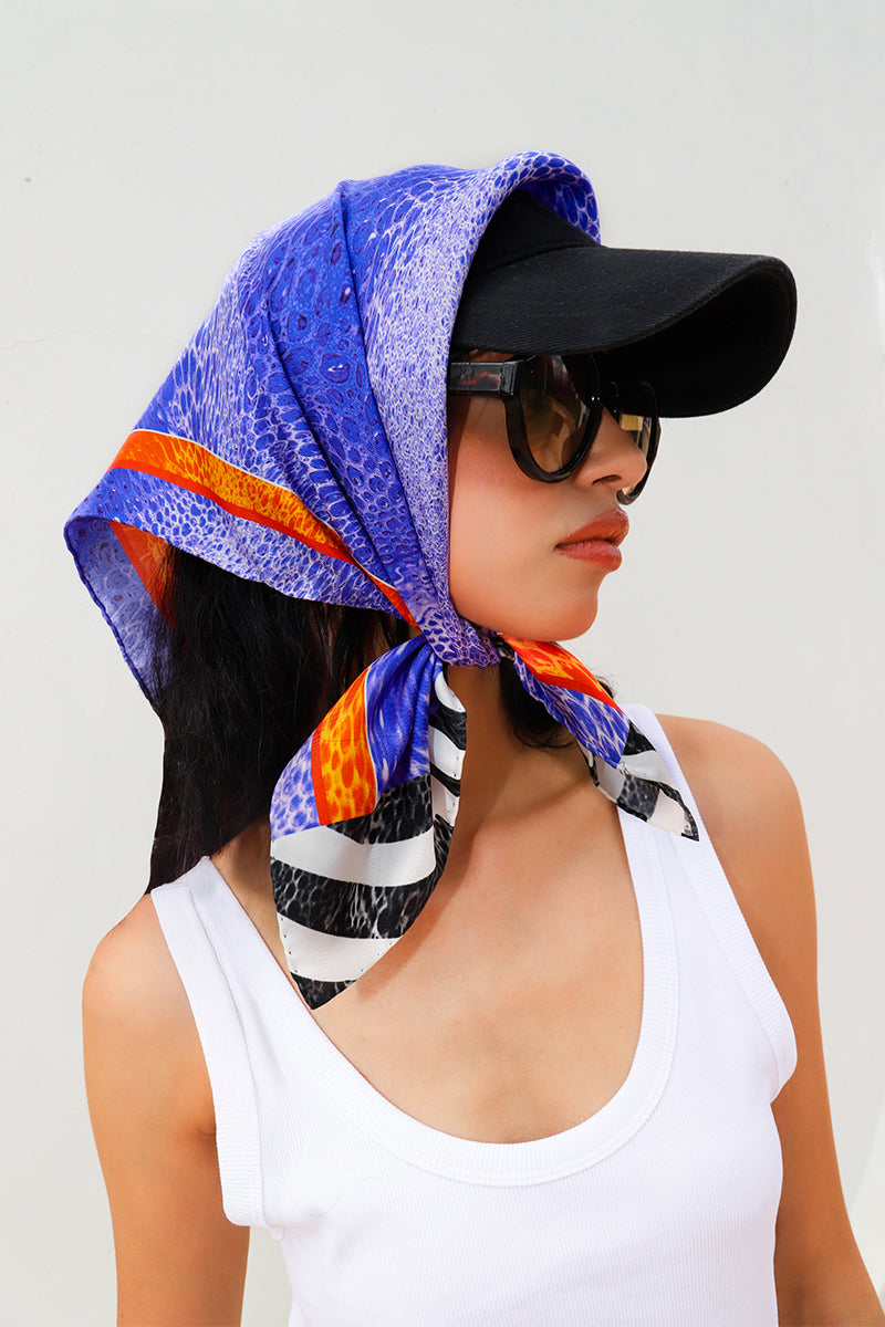 Small silk scarf from Amel Batita featuring a zoo-inspired Moussard design, perfect for stylish headwear or accessorizing.