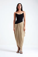 Black and beige Zosia maxi dress by Deme By Gabriella, flowing fabric, elegant design, shown on a model.