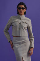 ZUT ZUKE cropped jacket in sandy beige fabric, stylish design with a collar and button front, displayed on a plain background.