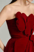 Red floral velvet and organza gown by HAPPY CLOTHING, featuring intricate floral patterns and elegant flowing fabric.
