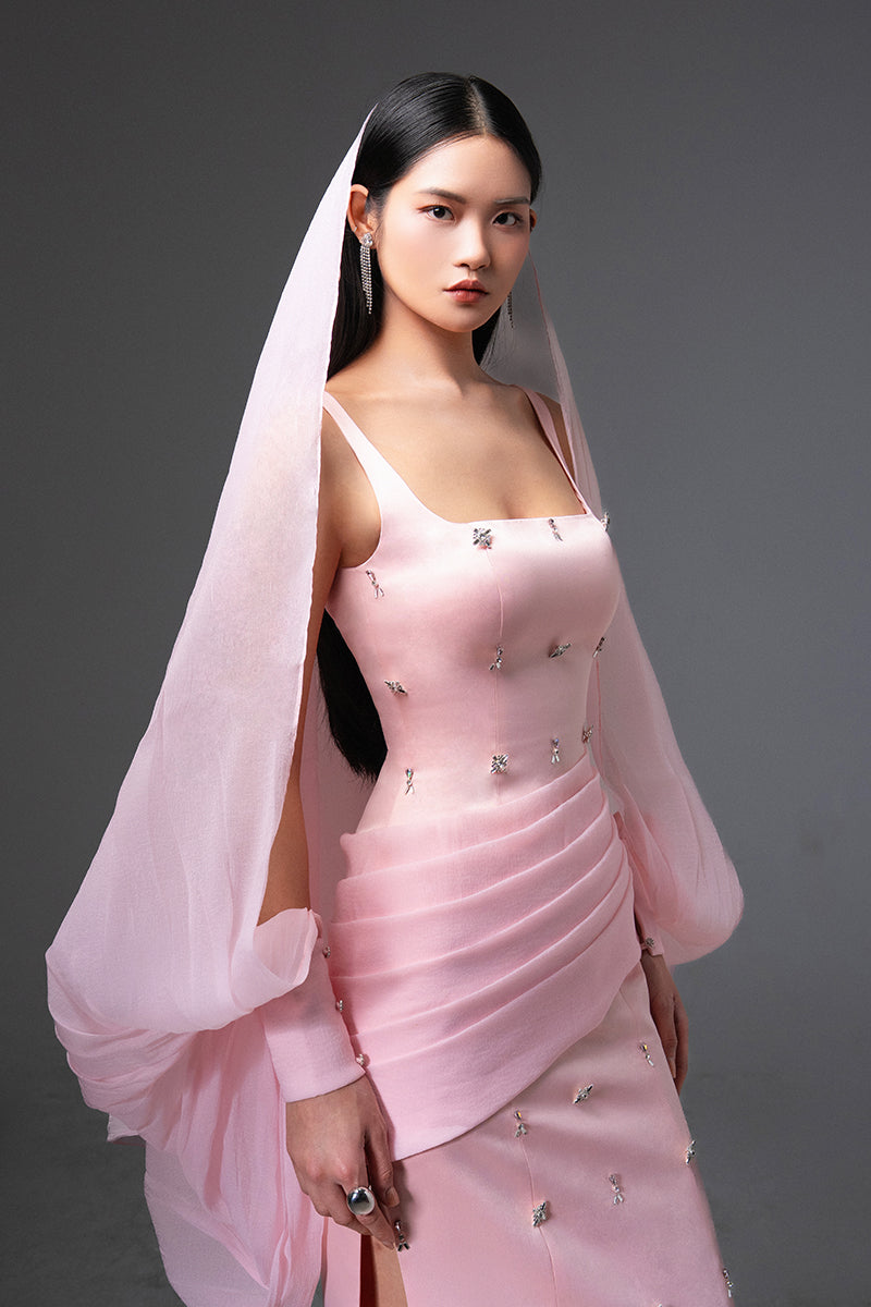 Pink CULT MIA X HAPPY CLOTHING Sienna cold shoulder taffeta gown with elegant design and ruffled sleeves on a model.
