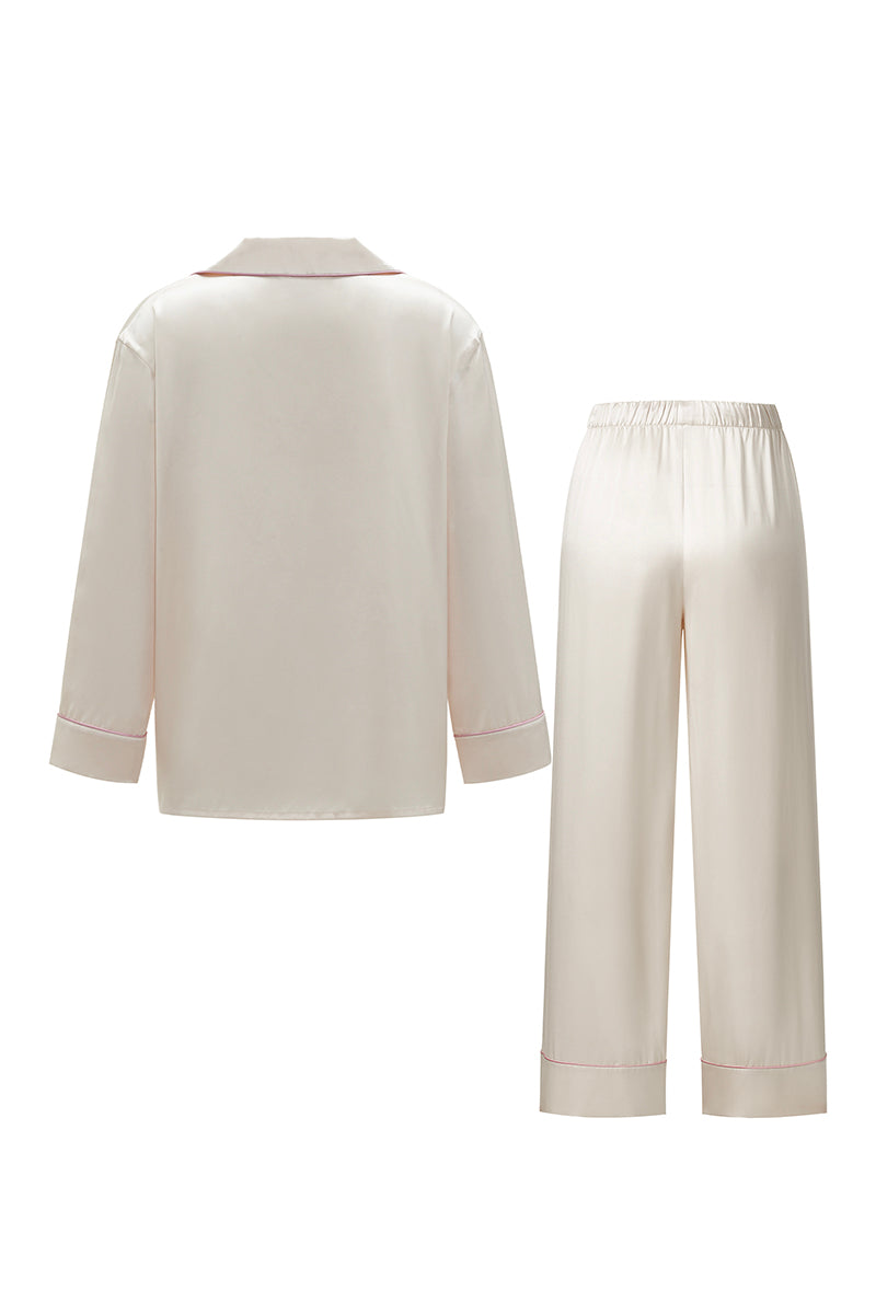 Blush pink silk long pajama set by Not Just Pajama from the Museum of Crush collection, featuring a relaxed fit and elegant design.