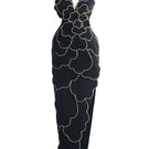 Black velvet V-neck petal strapless gown by Happy Clothing, shown with flowing fabric and elegant design details.