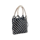 Black La Red mini leather bag by Adriana Castro, top handle design with sleek, compact silhouette and elegant finish.