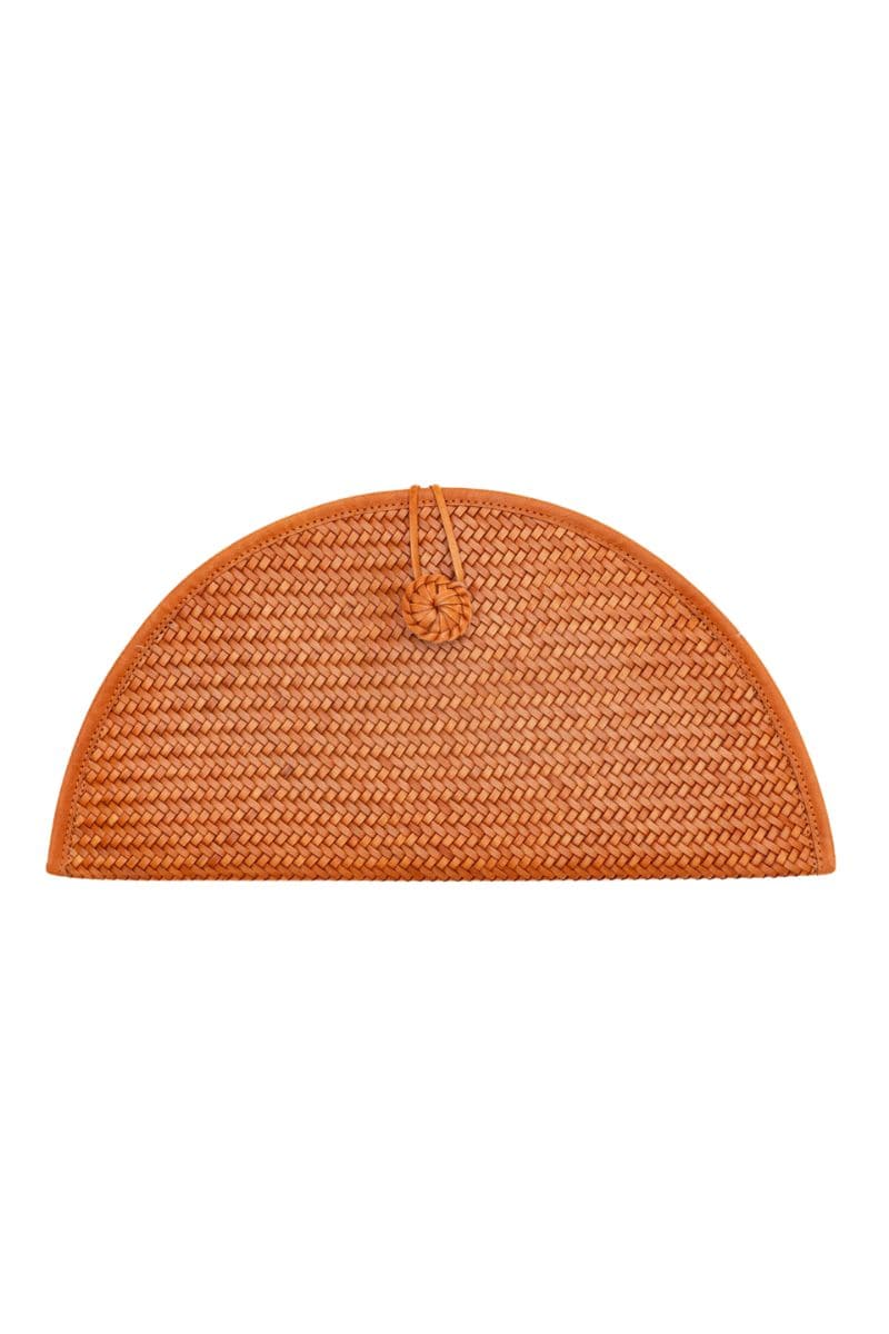Tan leather clutch from Adriana Castro with sleek design, featuring a fold-over flap and minimalist style.