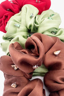Aethera Amara silk scrunchie set with rhinestone embellishments in crimson, pistachio, and brown, soft and elegant hair accessories.