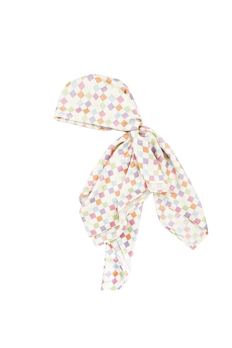 Aethera checked Charlotte silk square scarf and Isla silk front tie pareo set in multicolor, styled as hair accessories.