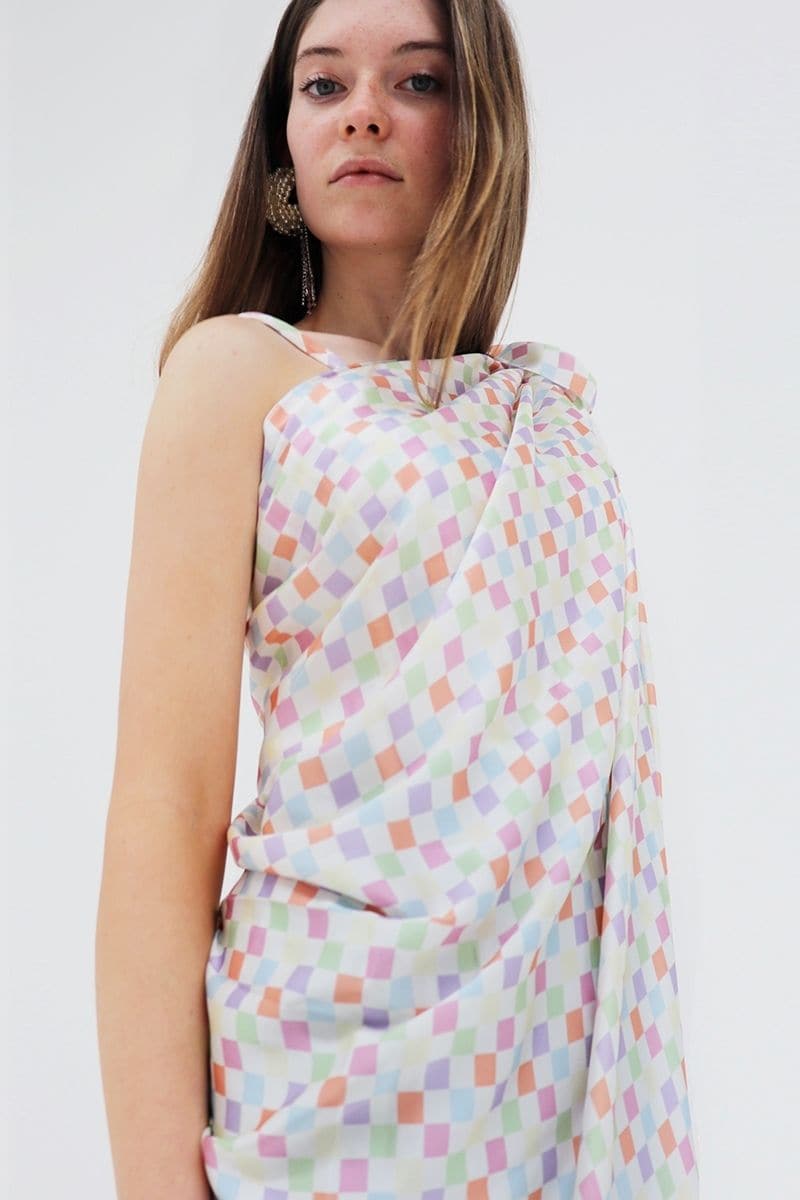 Multicolor checked Charlotte silk square scarf and Isla silk front tie pareo set by Aethera, featuring vibrant patterns and smooth silk fabric.