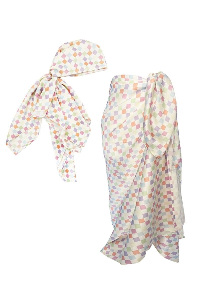 Aethera checked Charlotte silk square scarf and Isla silk front tie pareo set in multicolor, featuring elegant hair accessories.