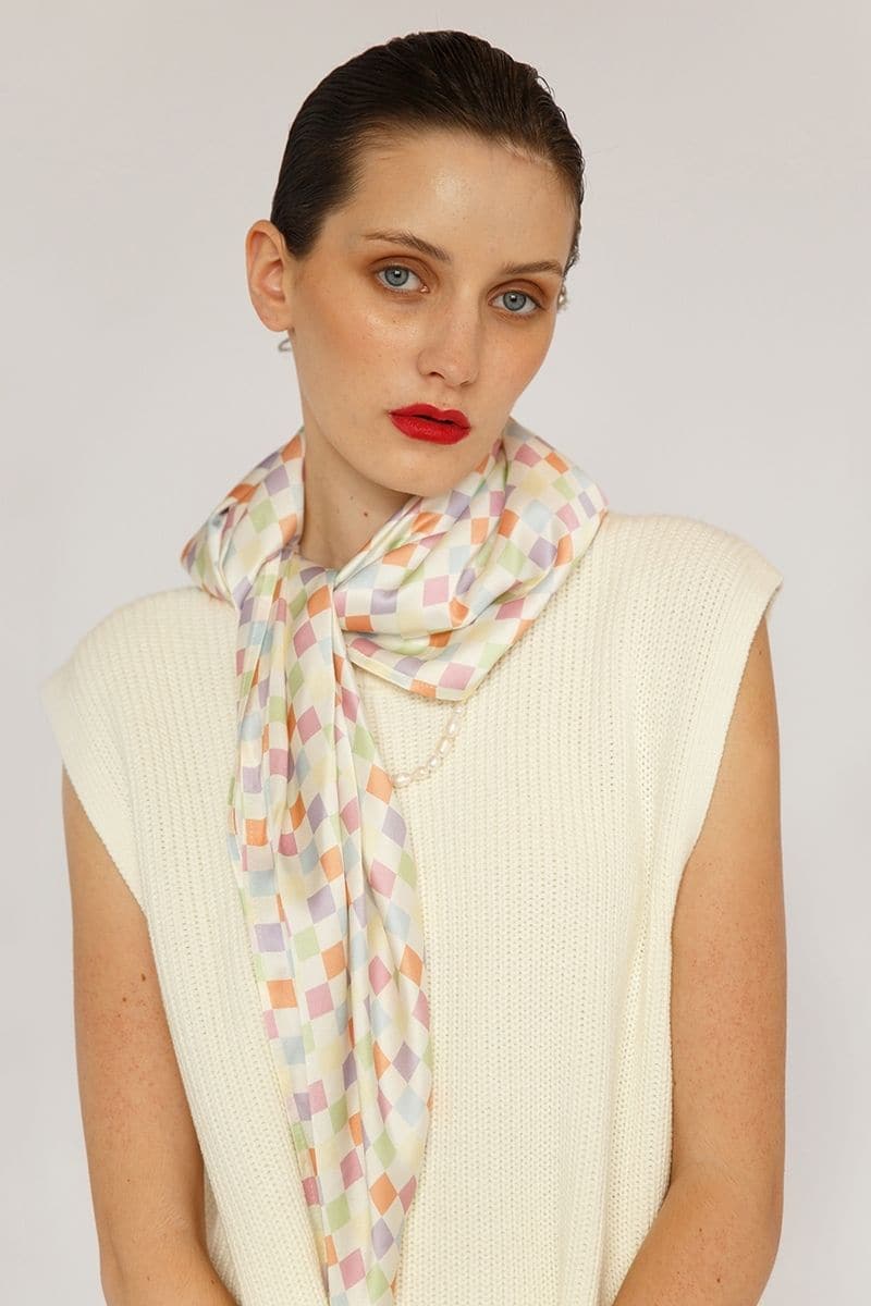 Aethera checked Charlotte silk square scarf and Isla silk front tie pareo set in vibrant multicolor, styled as fashionable hair accessories.