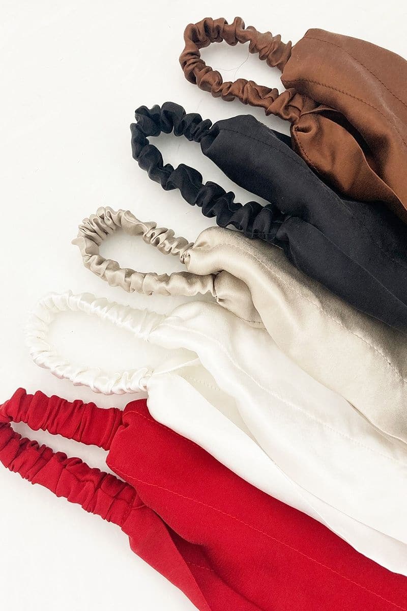 Aethera Claudine Nero Rose and Crimson silk headwrap set featuring elegant, vibrant hair accessories with floral-inspired designs.