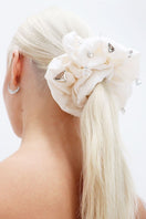 Aethera Fionnuala comb and Harlow oversized silk scrunchie set in Jade Pearl, featuring a decorative hair comb and large silk hair accessory.