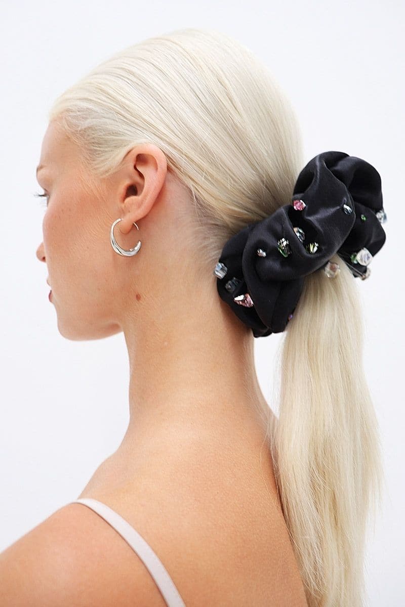 Aethera Ottilie and Oceania silk scrunchie set with black and pearl-colored hair accessories on a plain background.
