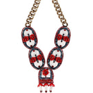 Red Oceana necklace by Aidan & Ice featuring vibrant red beads and a stylish design.