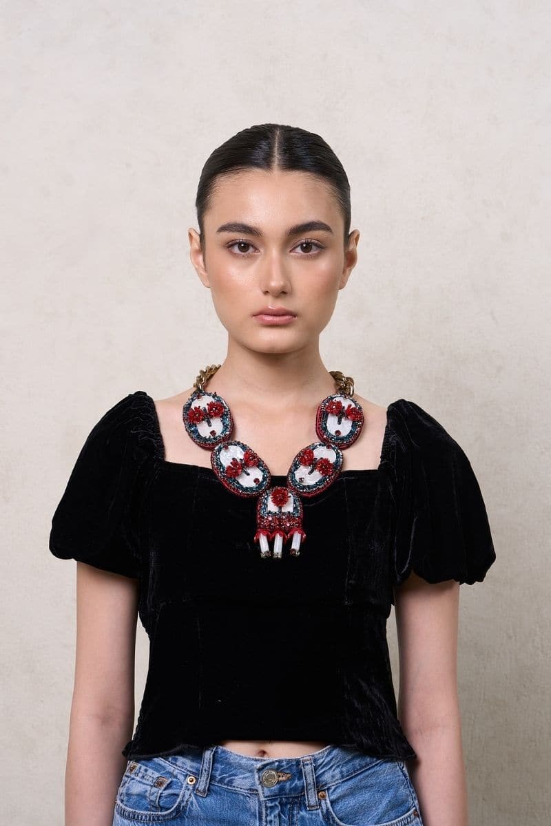 Red Oceana necklace by Aidan & Ice featuring a bold, stylish design with vibrant red beads and a sleek, modern look.