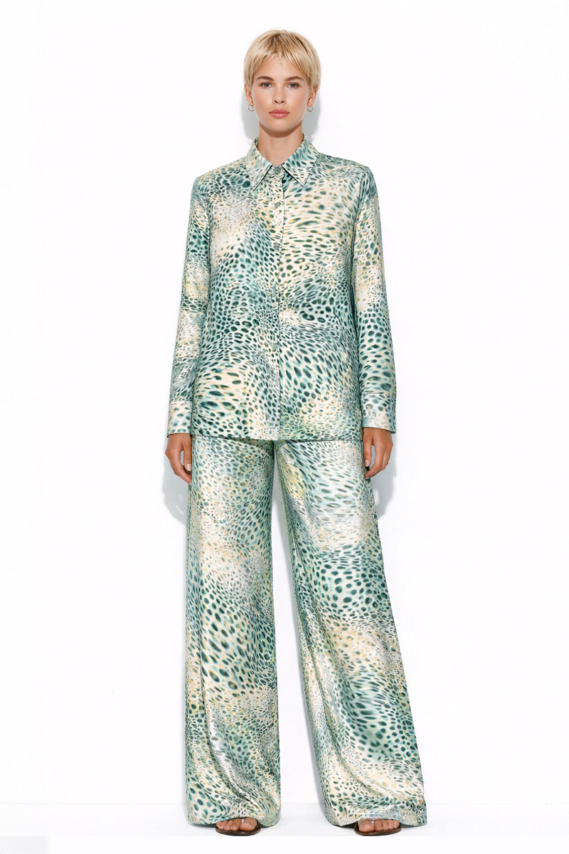 Creamy Moussard silk pants by Amel Batita featuring a relaxed fit and elegant design, shown with a matching silk shirt.