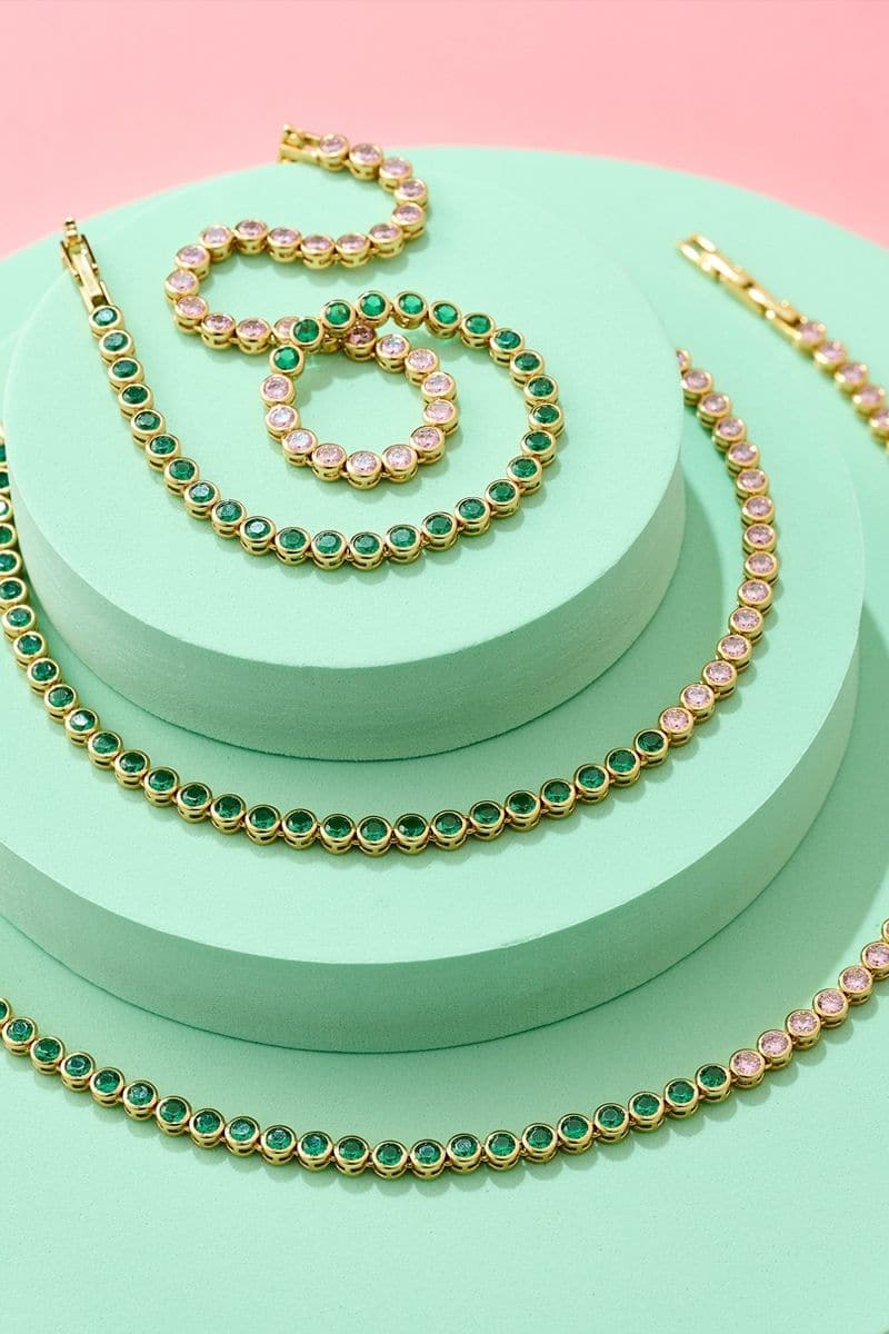 Gold and green dotty necklace by Amelia Scott featuring gold, emerald green, blush pink beads on a stylish chain.