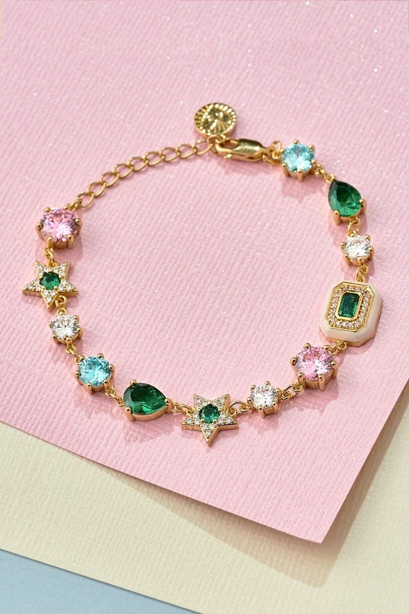 Gold Celeste bracelet by Amelia Scott featuring emerald green beads and delicate gold accents.