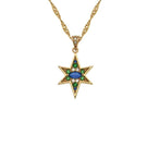 Gold Nova Necklace by Amelia Scott featuring emerald green and sapphire blue gemstones on a delicate gold chain.