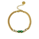 Gold Sofia bracelet by Amelia Scott featuring emerald green accents, elegant jewelry accessory with a sleek design.
