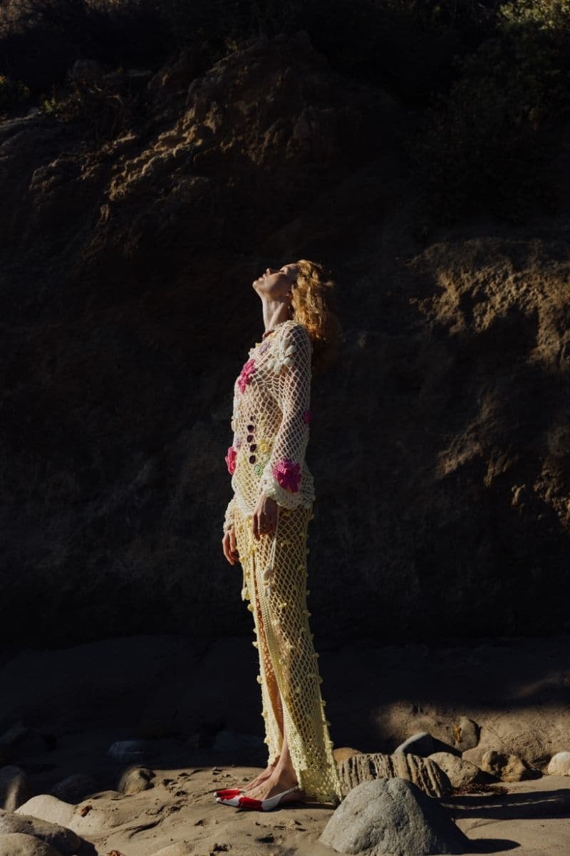 Multicolor handmade crochet top by Andreeva, lightweight and detailed with intricate crochet patterns, worn by a model.