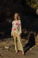 Multicolor handmade crochet top by Andreeva featuring intricate crochet patterns and a fitted design, displayed on a mannequin.