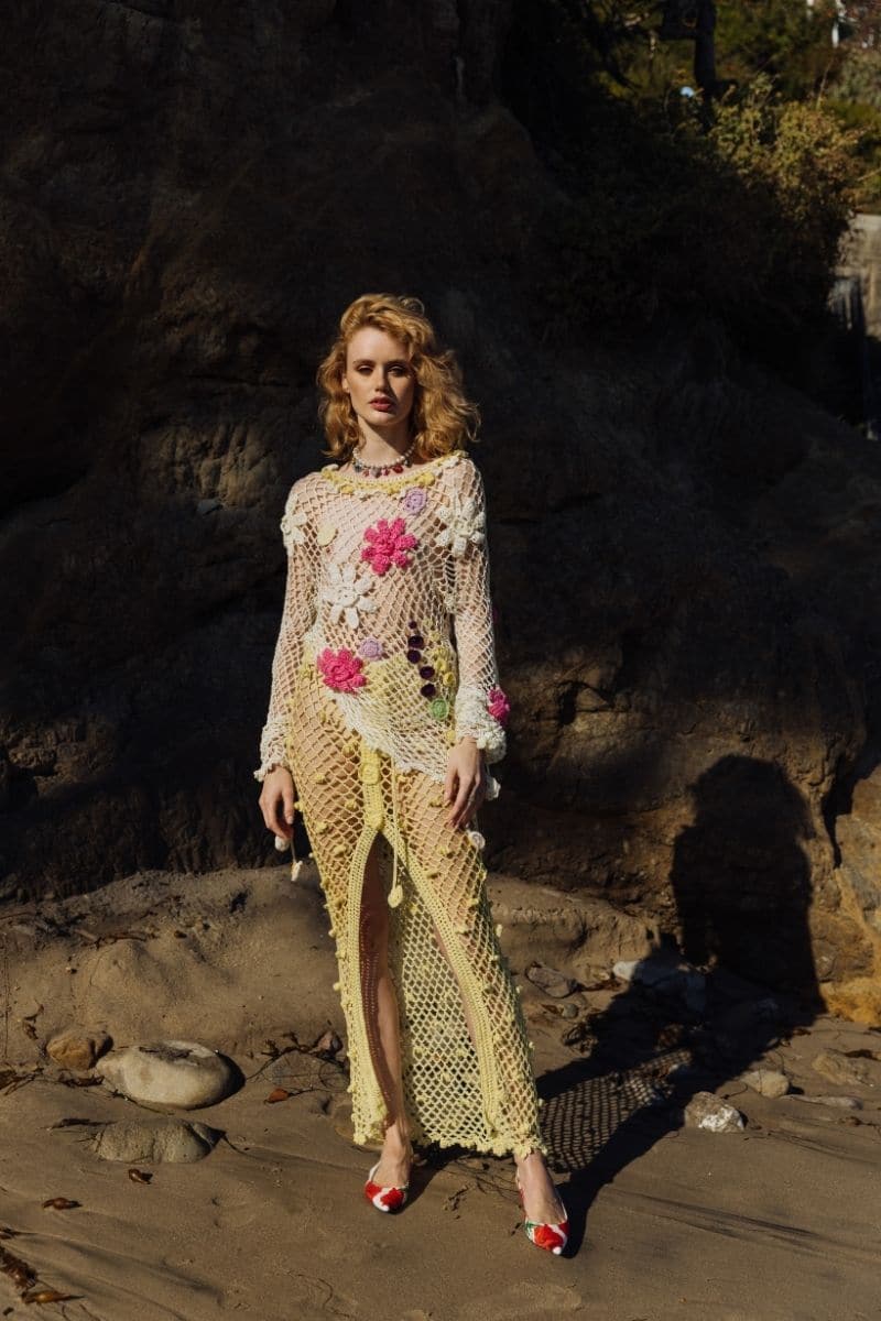 Multicolor handmade crochet top by Andreeva featuring intricate crochet patterns and a fitted design, displayed on a mannequin.