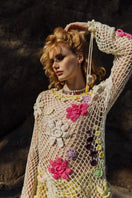 Multicolor handmade crochet top by Andreeva featuring intricate knitting and a fitted design, shown on a white background.