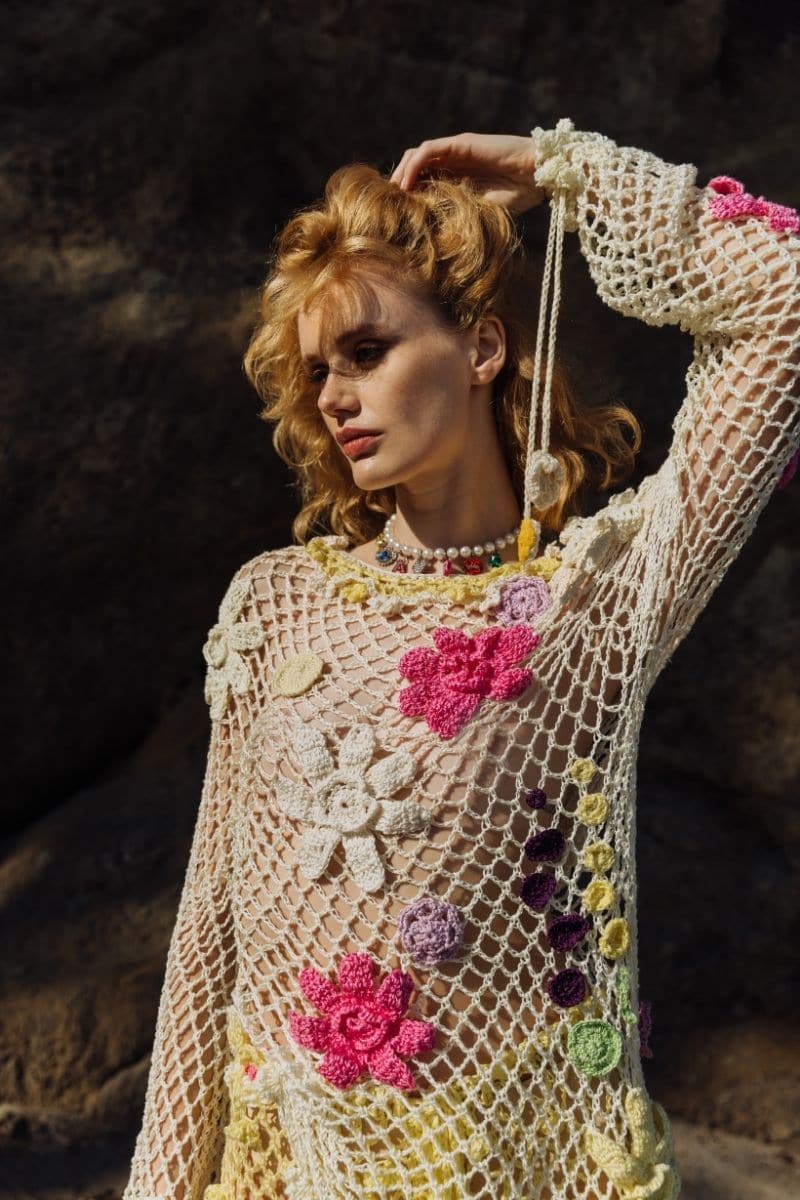 Multicolor handmade crochet top by Andreeva featuring intricate knitting and a fitted design, shown on a white background.