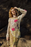 Multicolor handmade crochet top by Andreeva, featuring intricate crochet patterns and a fitted design, displayed on a mannequin.