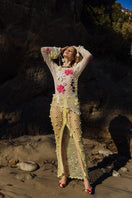 Multicolor handmade crochet top by Andreeva featuring intricate crochet patterns and a fitted design, shown on a model.